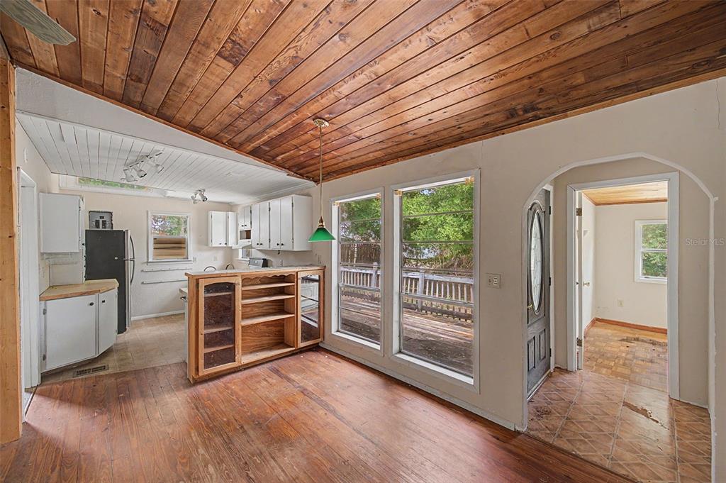Cutrone Road Winter Haven, FL 33880 - Photo 15 of 50 a view of a kitchen with fridge and wooden floor