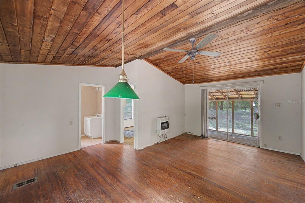 Cutrone Road Winter Haven, FL 33880 - Photo 17 of 50 an empty room with wooden floor and windows