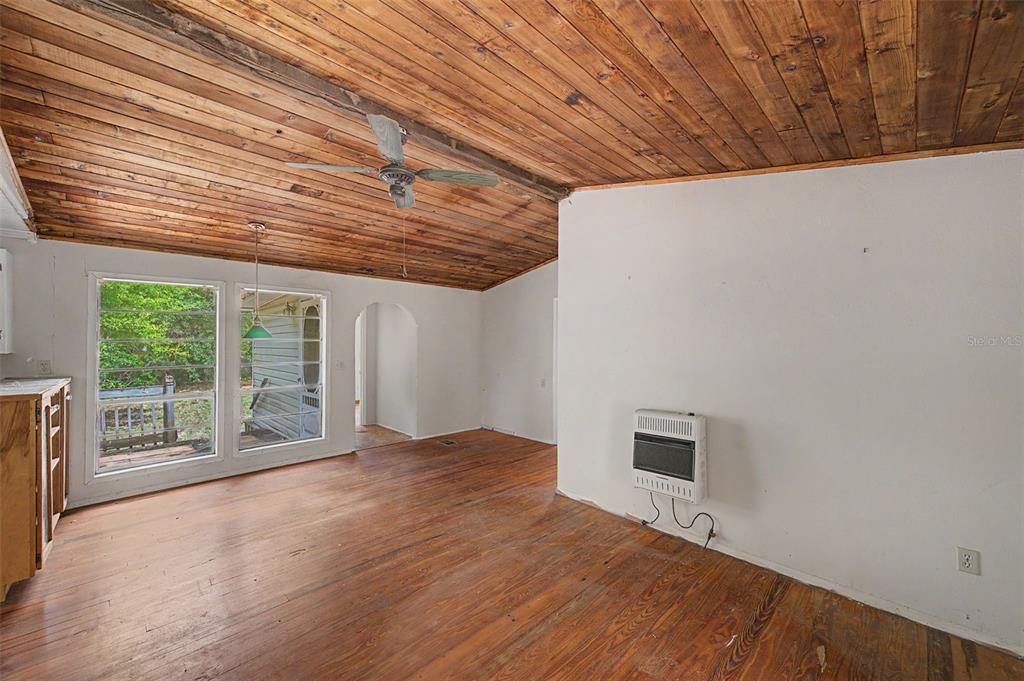 Cutrone Road Winter Haven, FL 33880 - Photo 18 of 50 a view of an empty room with a window and wooden floor