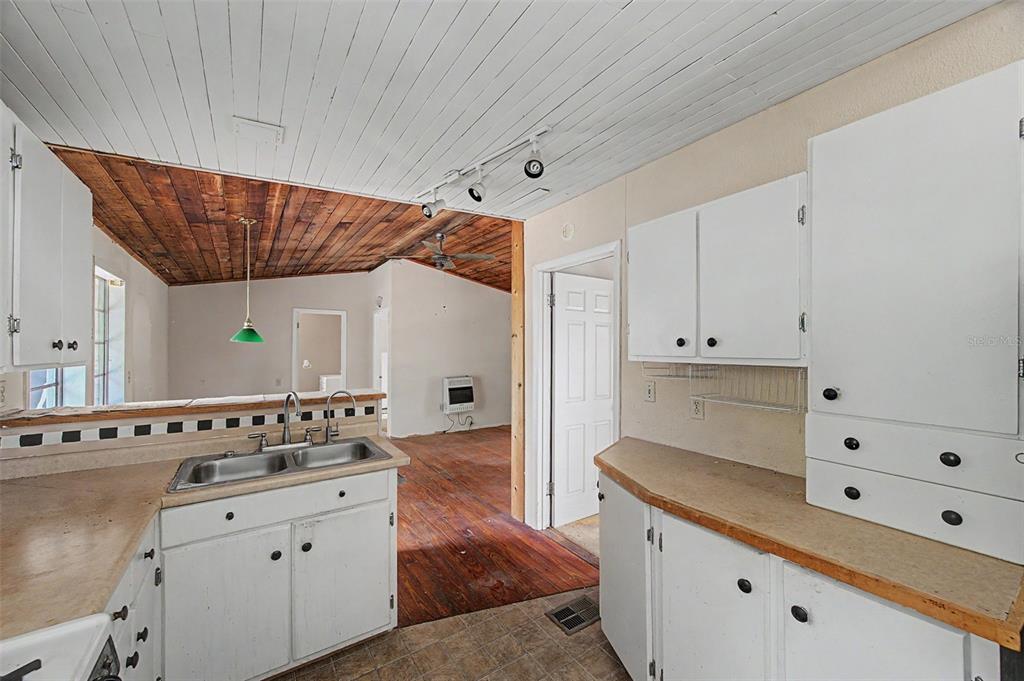 Cutrone Road Winter Haven, FL 33880 - Photo 22 of 50 a kitchen with granite countertop white cabinets and white appliances