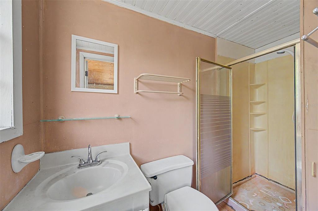 Cutrone Road Winter Haven, FL 33880 - Photo 28 of 50 a bathroom with a sink mirror and toilet