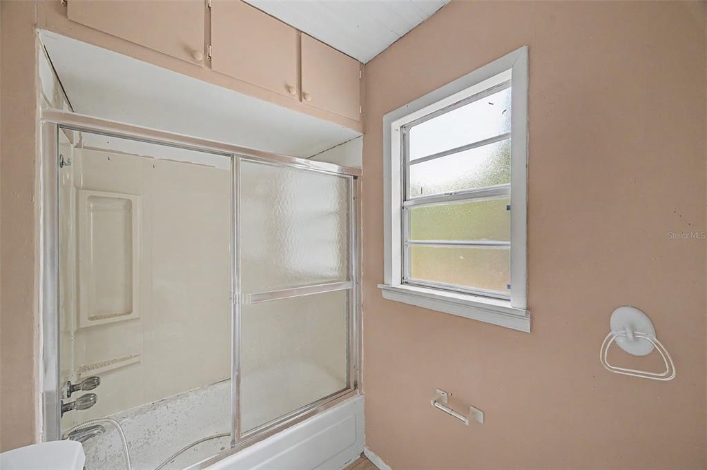 Cutrone Road Winter Haven, FL 33880 - Photo 40 of 50 a bathroom with a glass shower door