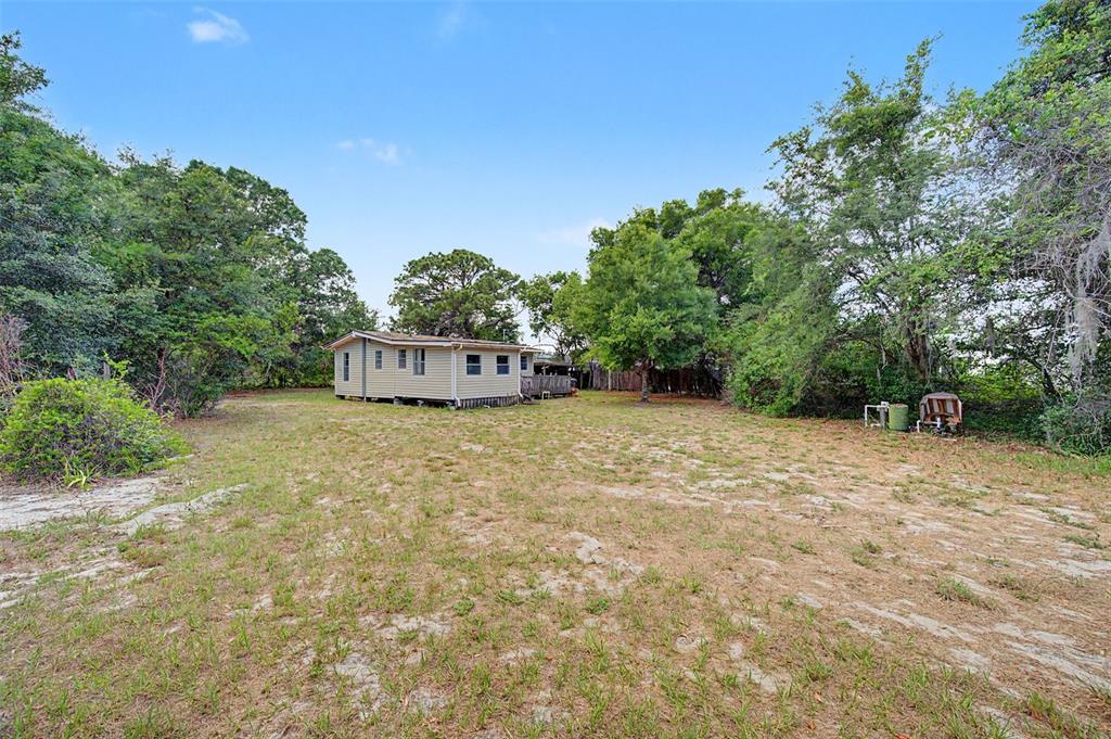 Cutrone Road Winter Haven, FL 33880 - Photo 4 of 50 a backyard of a house with lots of green space