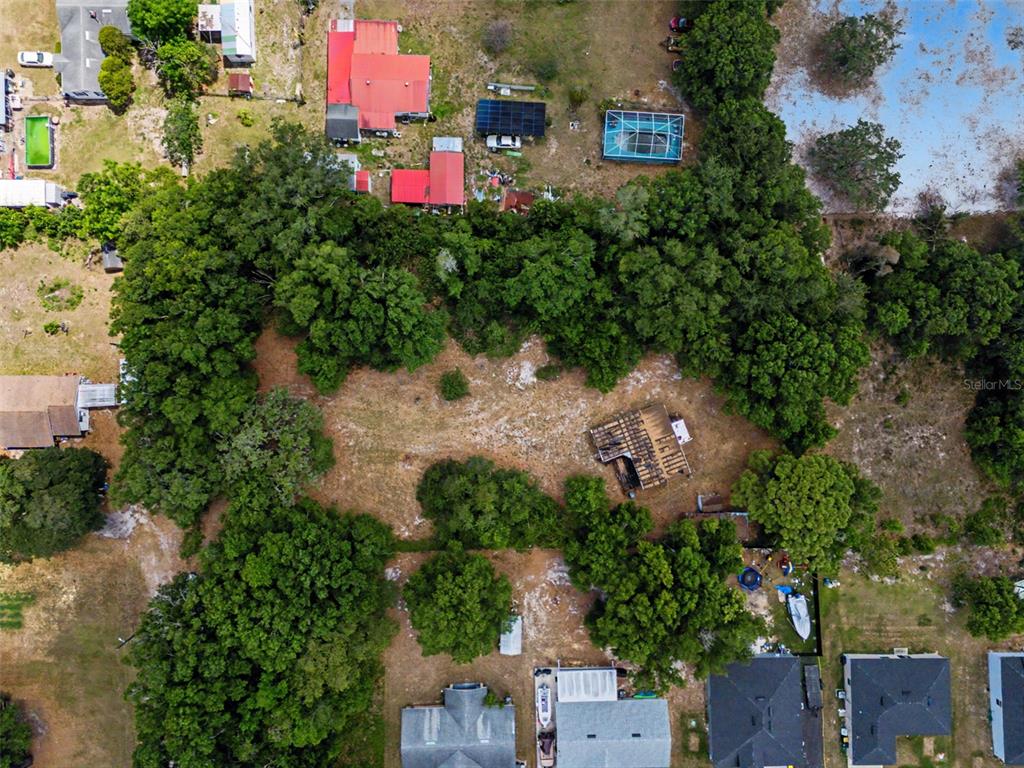 Cutrone Road Winter Haven, FL 33880 - Photo 44 of 50 an aerial view of a house with a yard and garden