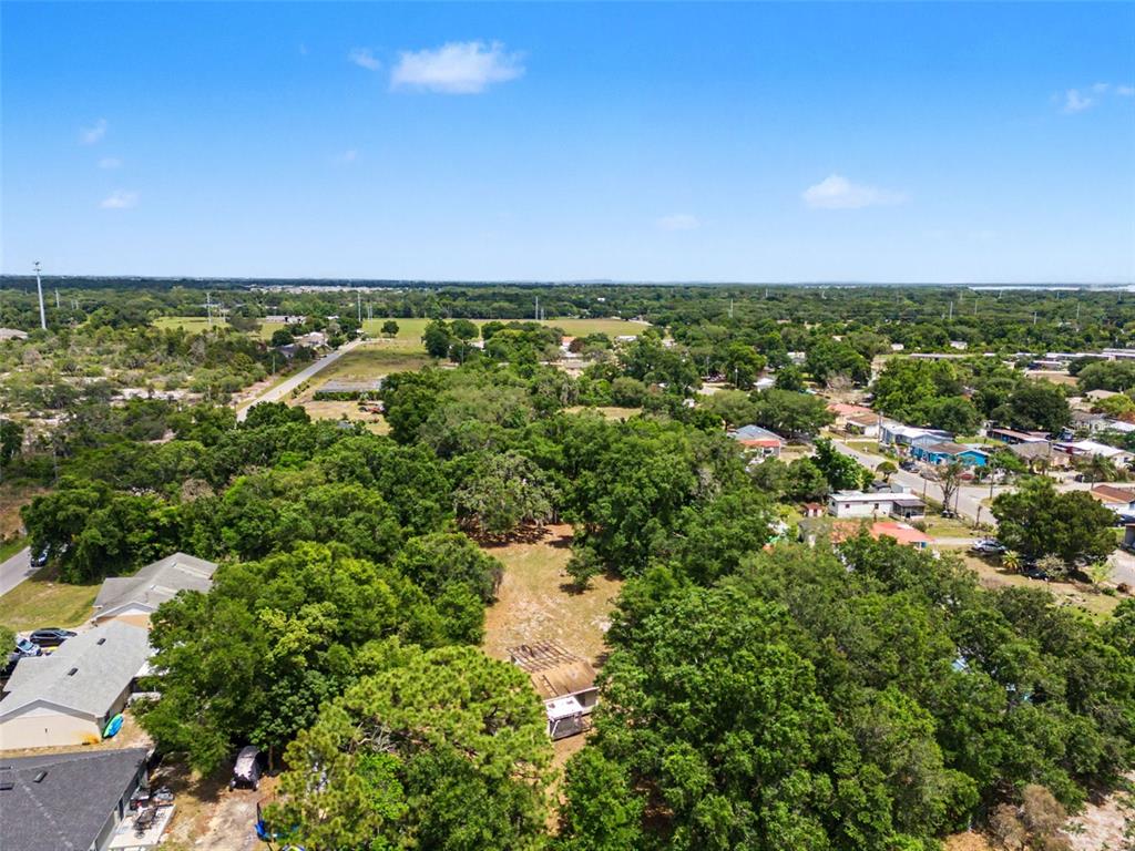 Cutrone Road Winter Haven, FL 33880 - Photo 45 of 50 an aerial view of residential houses with outdoor space and trees