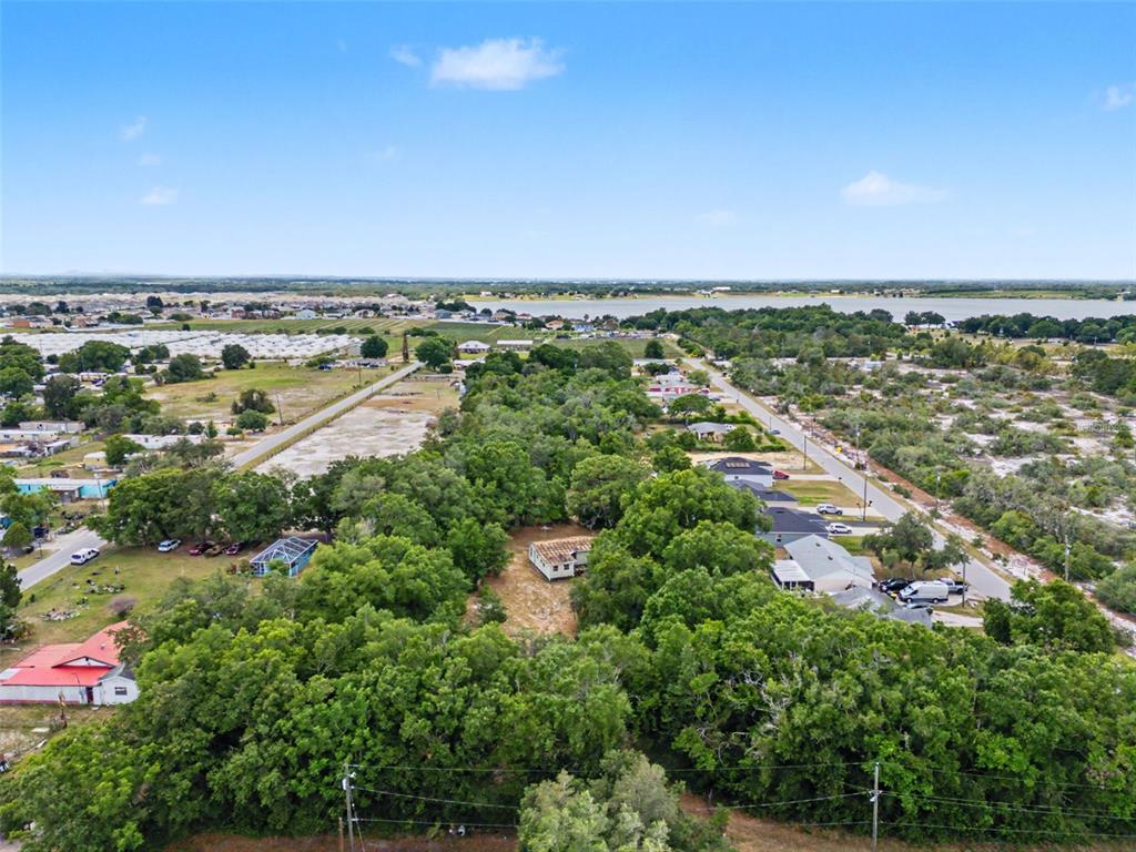 Cutrone Road Winter Haven, FL 33880 - Photo 46 of 50 an aerial view of a city with lots of residential buildings and ocean view in back