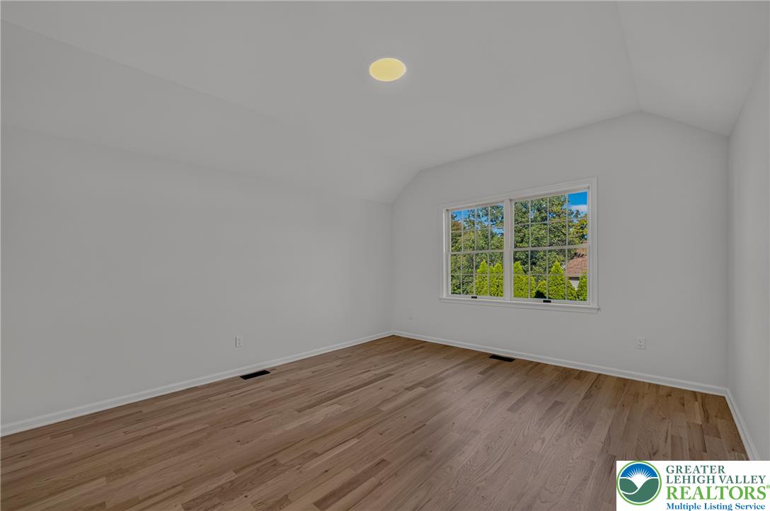 3130 Muirfield Road Center Valley, PA 18034 - Photo 42 of 63 Hardwood floors and vaulted ceilings elevate this versatile upper-level space.
