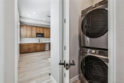 a view of a kitchen with washer and dryer