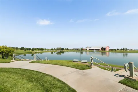 a view of a lake with houses with outdoor space