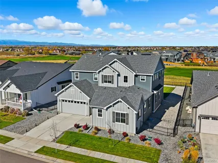 an aerial view of residential houses with outdoor space and street view