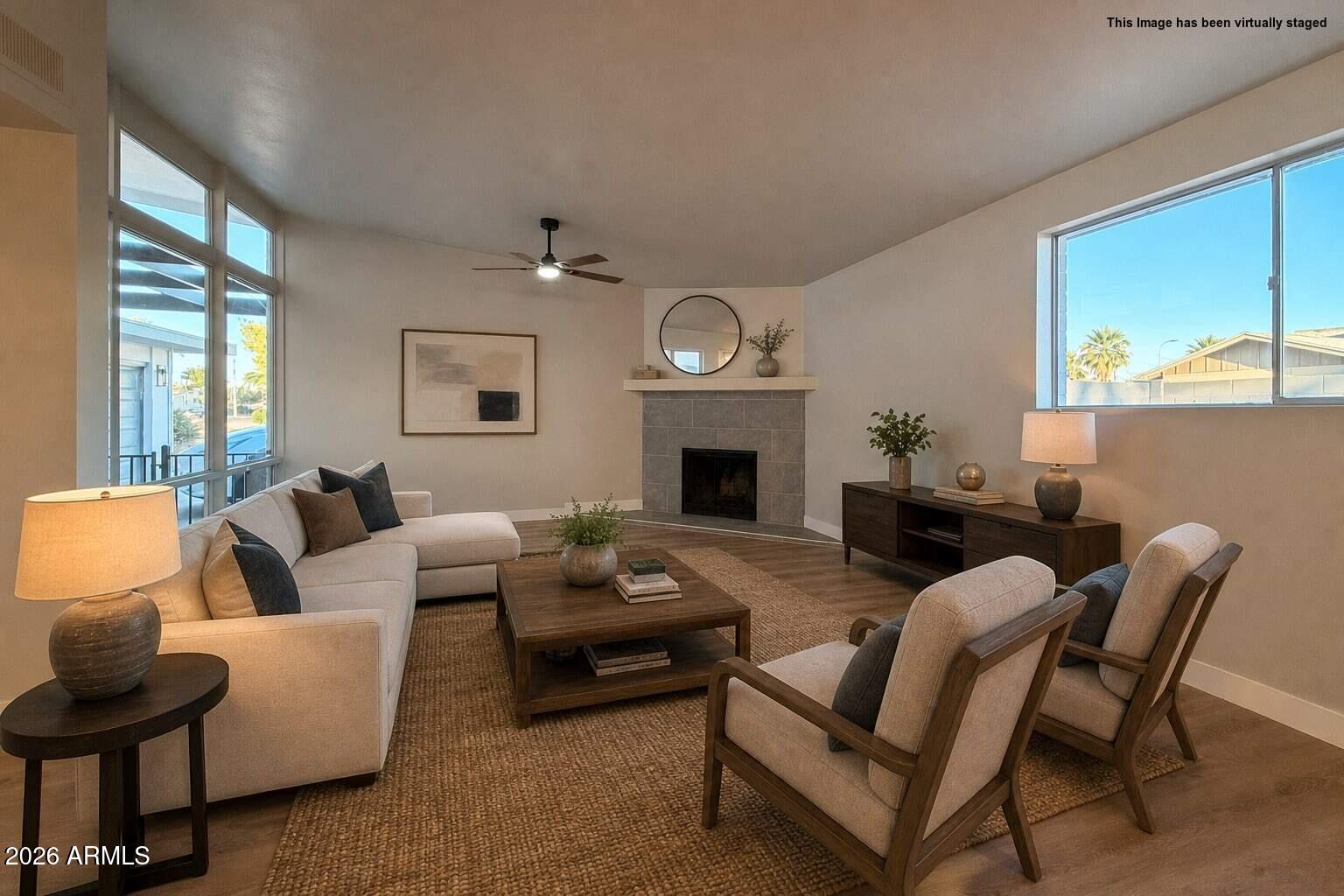 5420 North Granite Reef Road Scottsdale, AZ 85250 - Photo 8 of 30 a living room with furniture and a fireplace