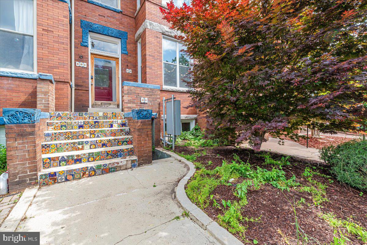 30 R Street Northeast, Unit B Washington, DC 20002 - Photo 2 of 21 front view of a house with a garden