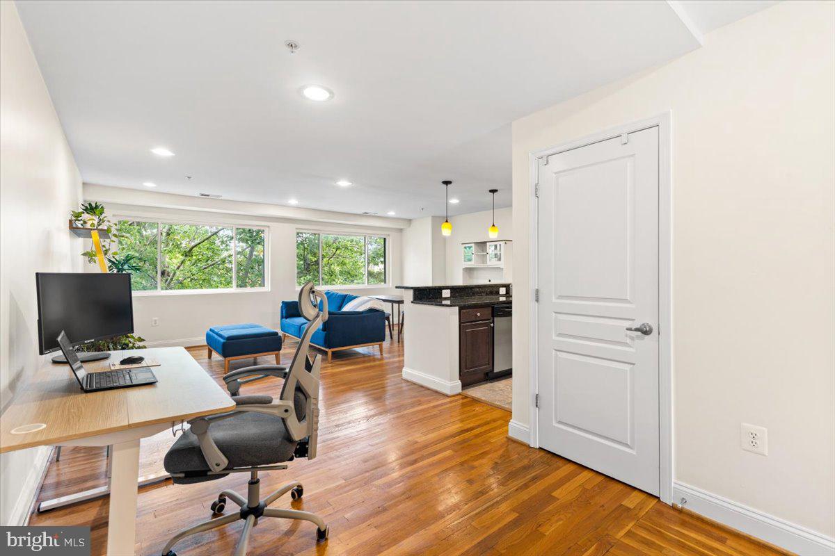 804 Taylor Street Northwest, Unit 403 Washington, DC 20011 - Photo 11 of 35 a workspace with wooden floor and a workspace