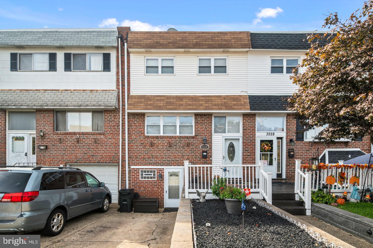 3230 Birch Road Philadelphia, PA 19154 - Photo 2 of 38 a view of a car park in front of a brick house