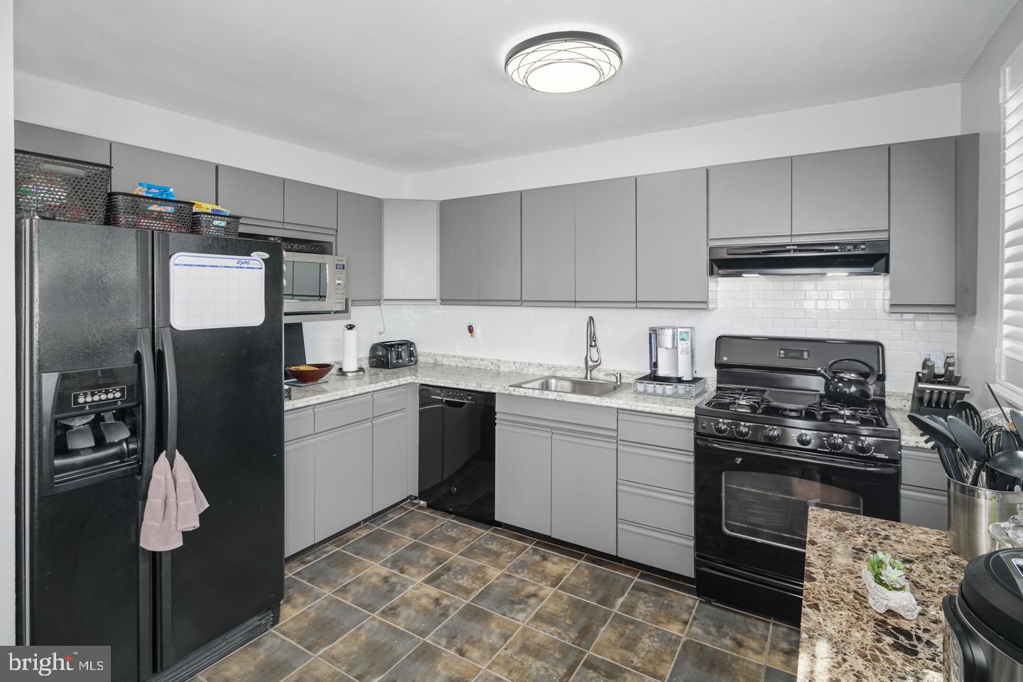 3230 Birch Road Philadelphia, PA 19154 - Photo 15 of 38 a kitchen with a sink appliances and cabinets