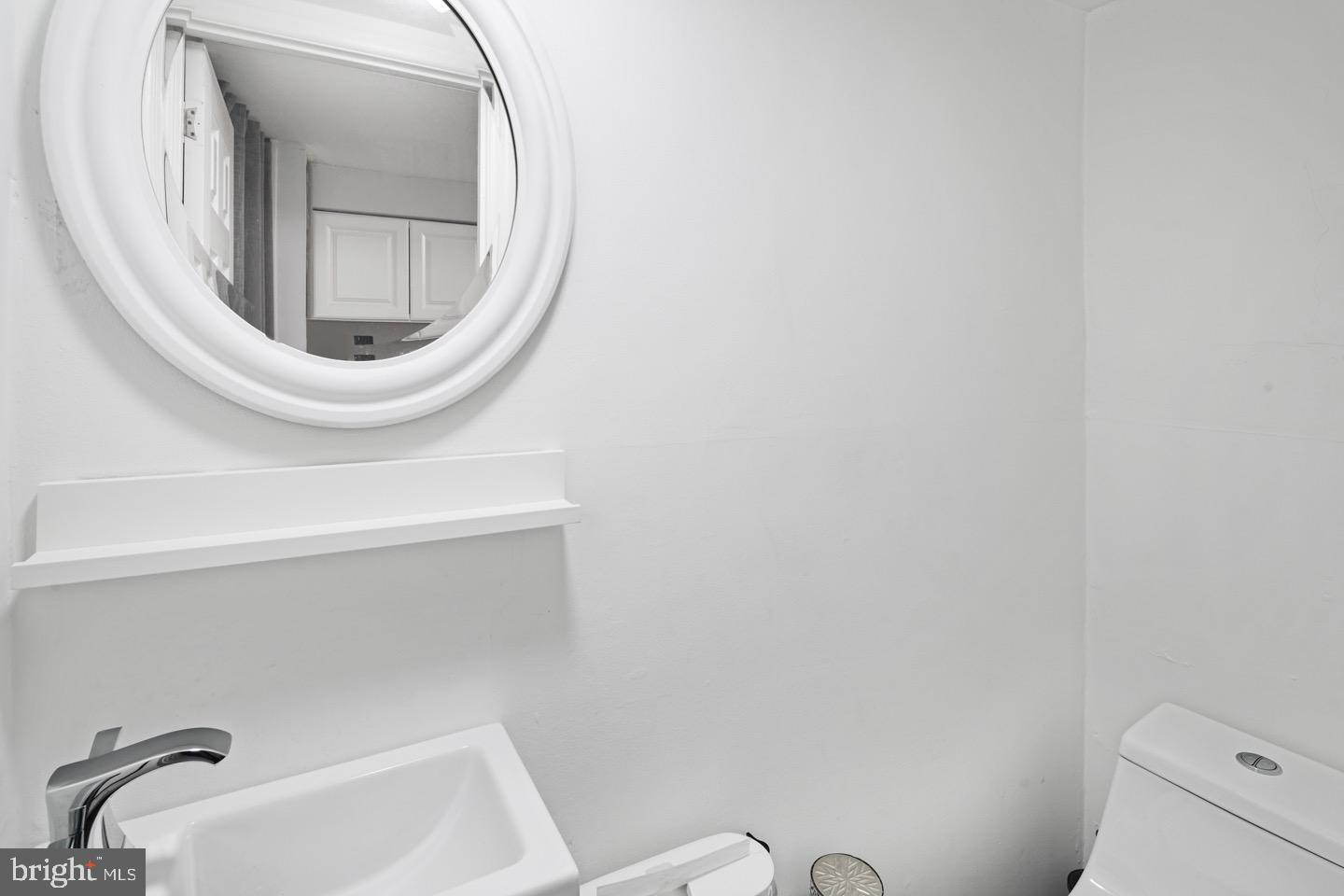 3230 Birch Road Philadelphia, PA 19154 - Photo 27 of 38 a bathroom with a toilet and a sink