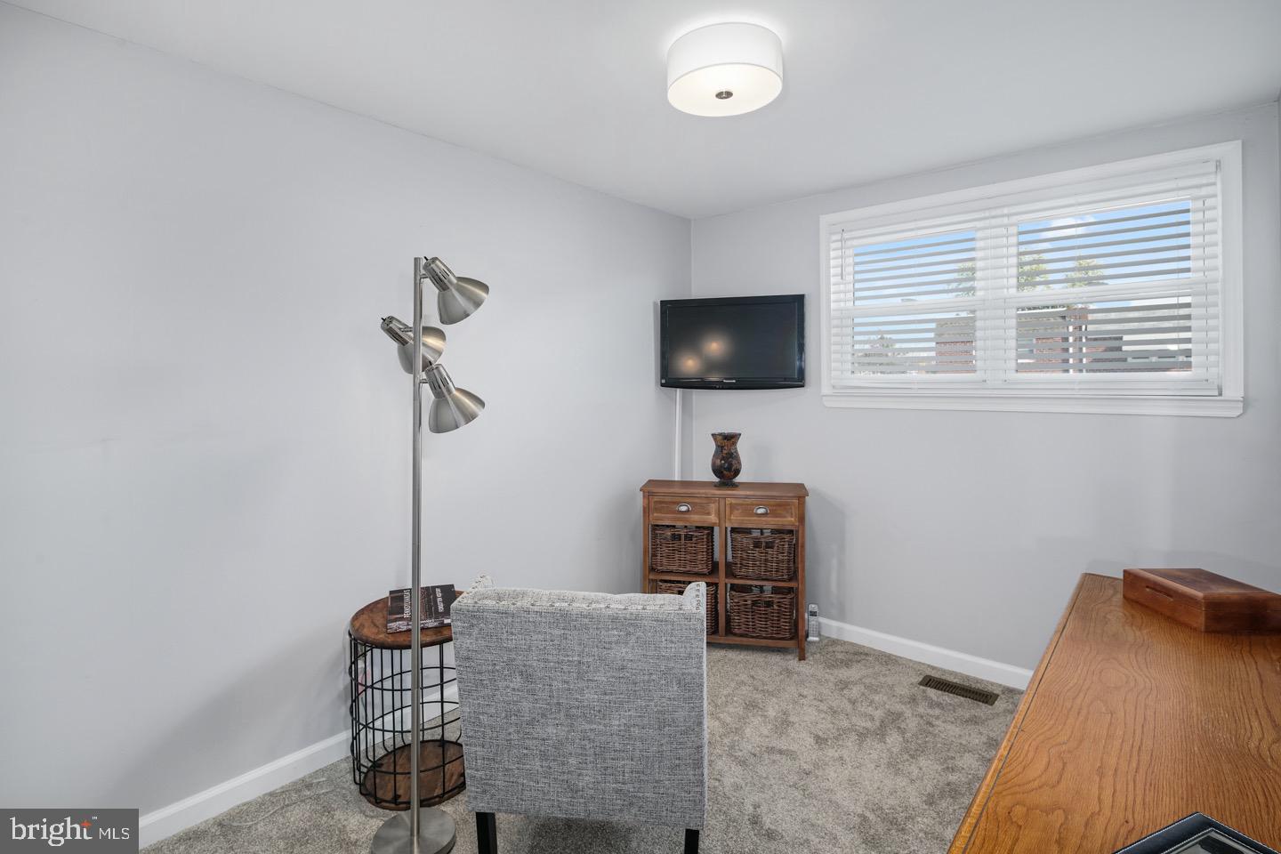 3230 Birch Road Philadelphia, PA 19154 - Photo 28 of 38 a living room with furniture and a flat screen tv
