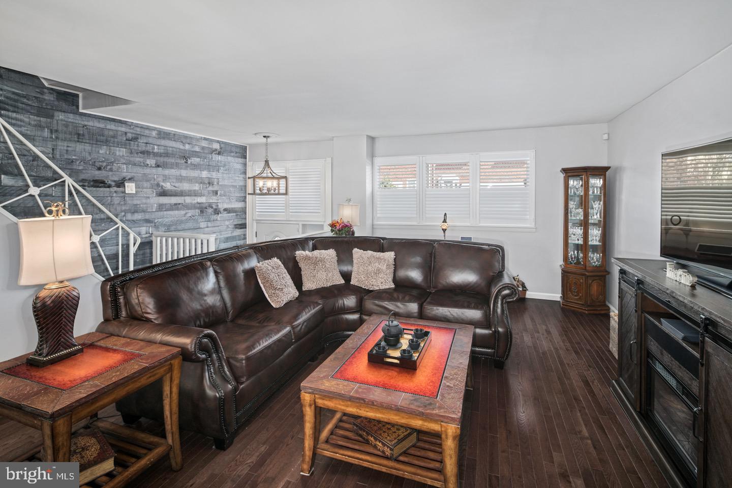 3230 Birch Road Philadelphia, PA 19154 - Photo 9 of 38 a living room with furniture a flat screen tv and a fireplace