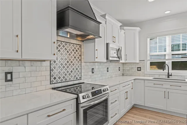 a bathroom with a sink vanity and a mirror