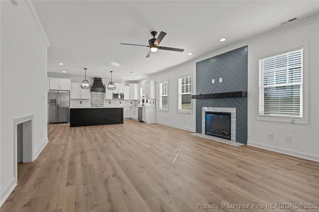 a view of a kitchen with a sink and a stove top oven