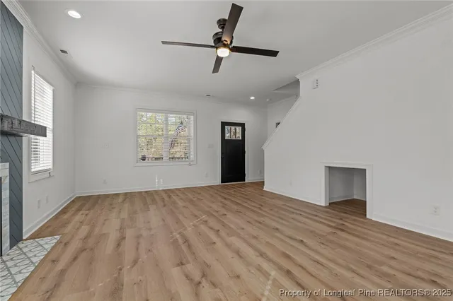 a kitchen with stainless steel appliances a sink stove and cabinets