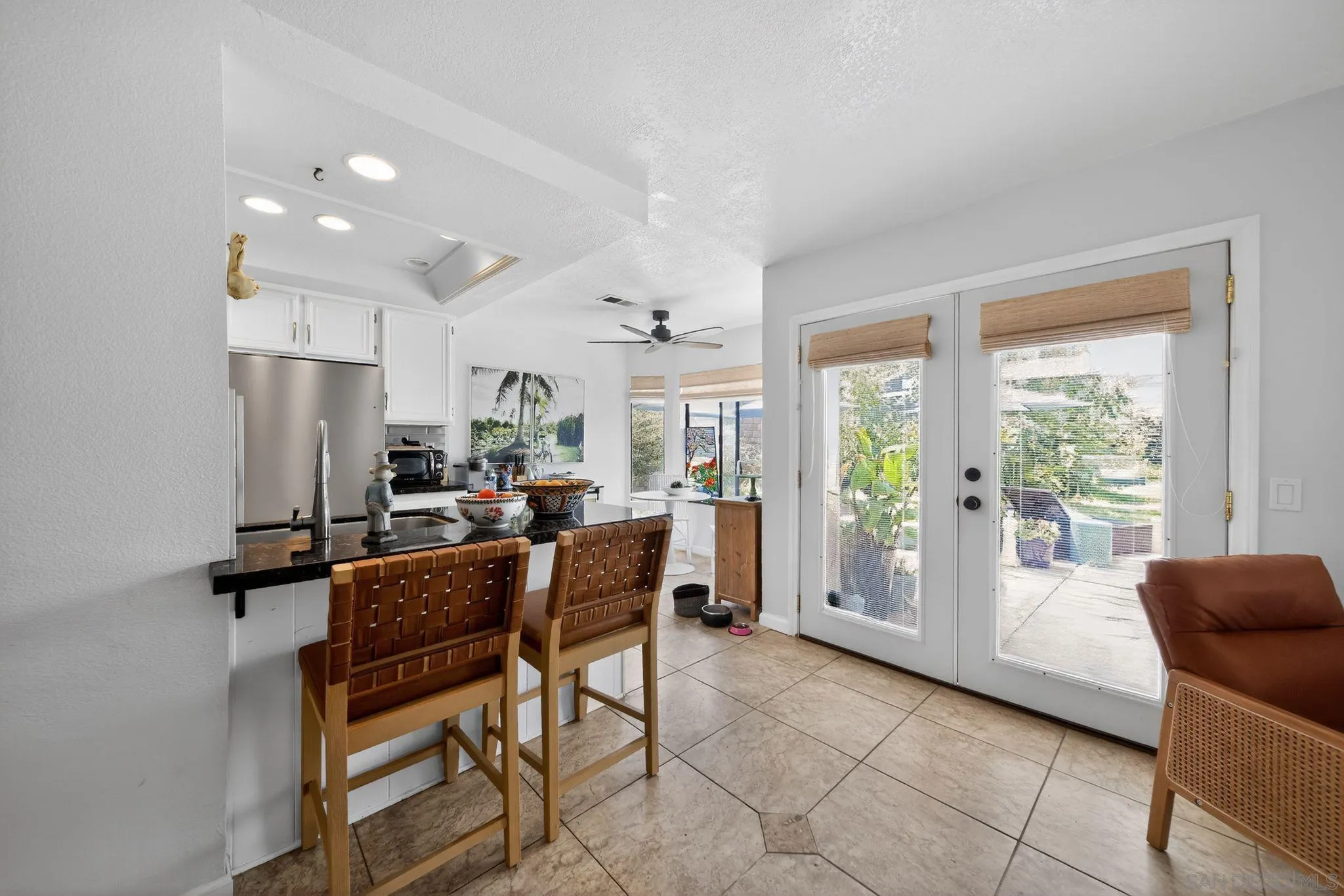 5287 Rio Plata Drive Oceanside, CA 92057 - Photo 17 of 38 a dining room with furniture and a chandelier