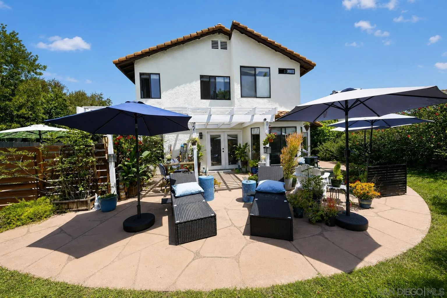 5287 Rio Plata Drive Oceanside, CA 92057 - Photo 23 of 38 a view of a house with backyard sitting area and garden