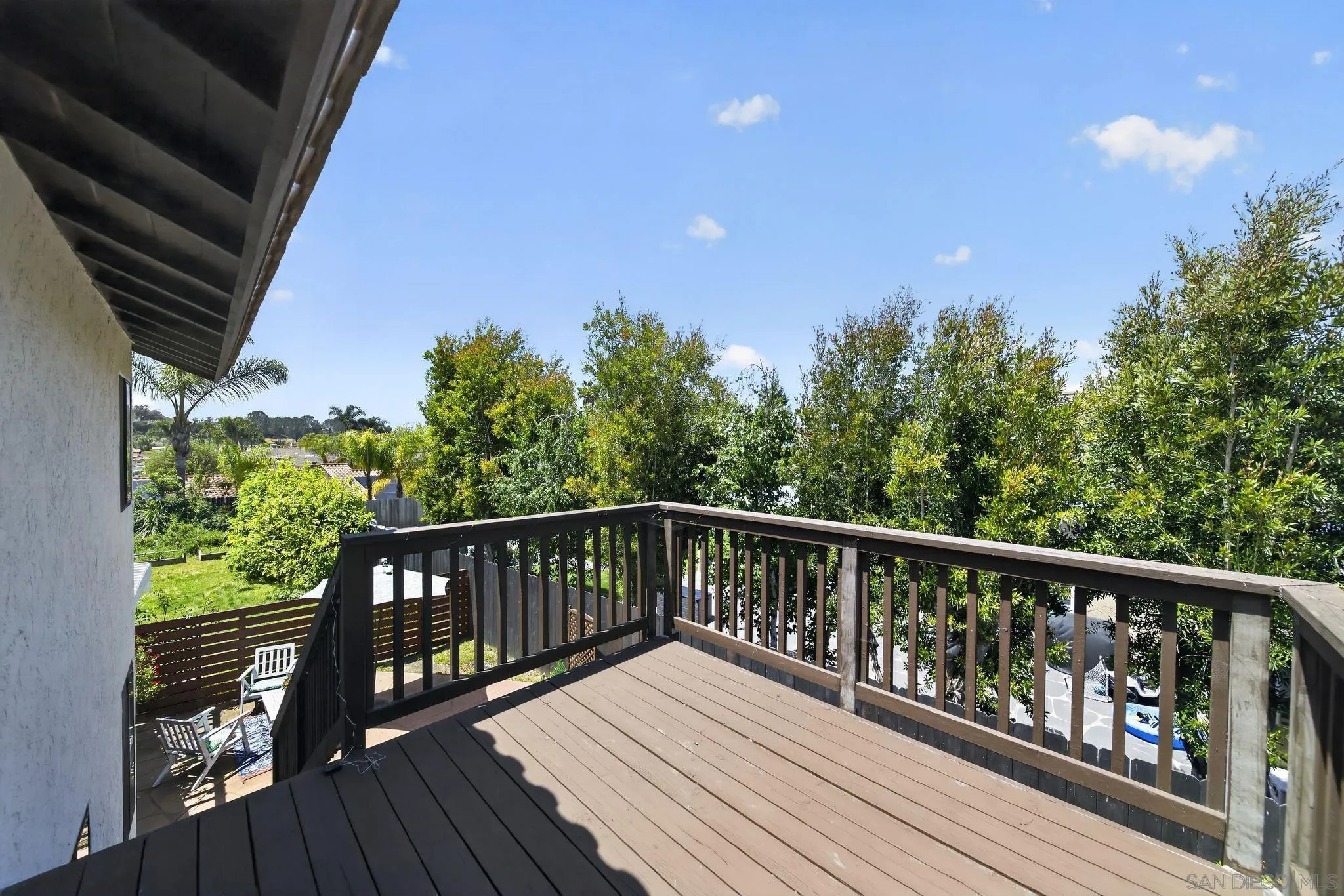 5287 Rio Plata Drive Oceanside, CA 92057 - Photo 26 of 38 a balcony with wooden floor and fence