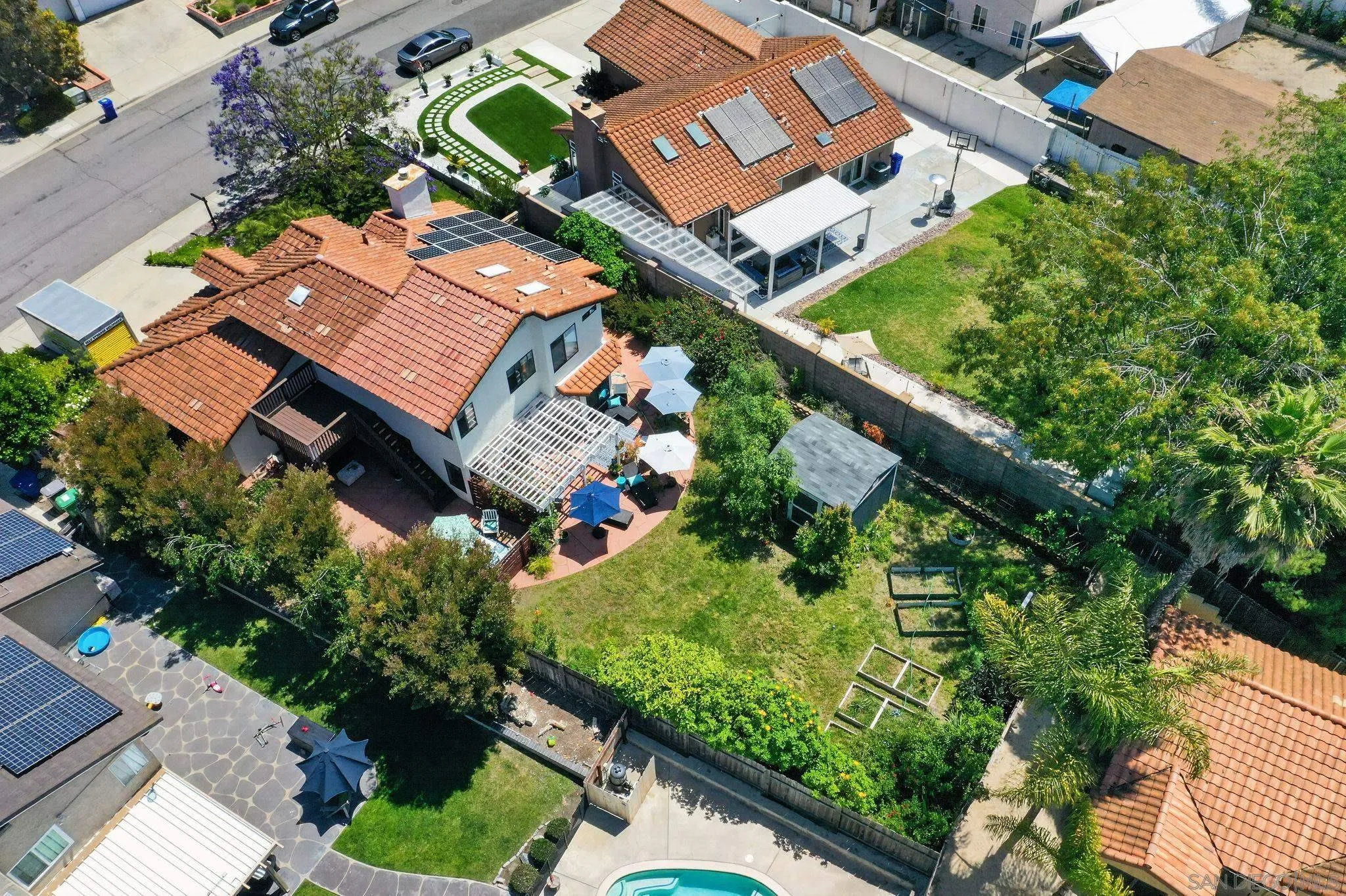 5287 Rio Plata Drive Oceanside, CA 92057 - Photo 35 of 38 an aerial view of a house with a garden and swimming pool