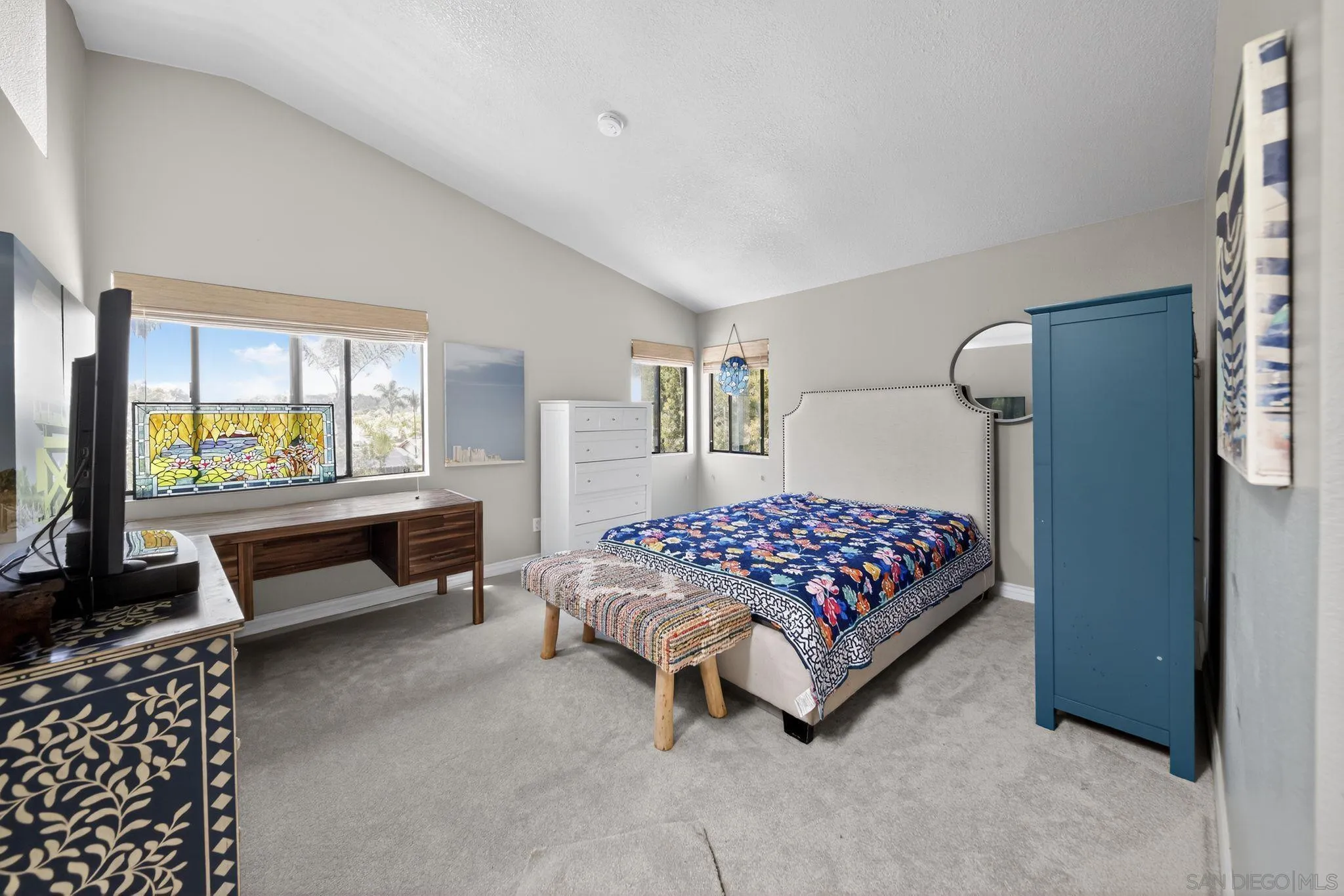 5287 Rio Plata Drive Oceanside, CA 92057 - Photo 7 of 38 a bedroom with a bed and a couch next to a window