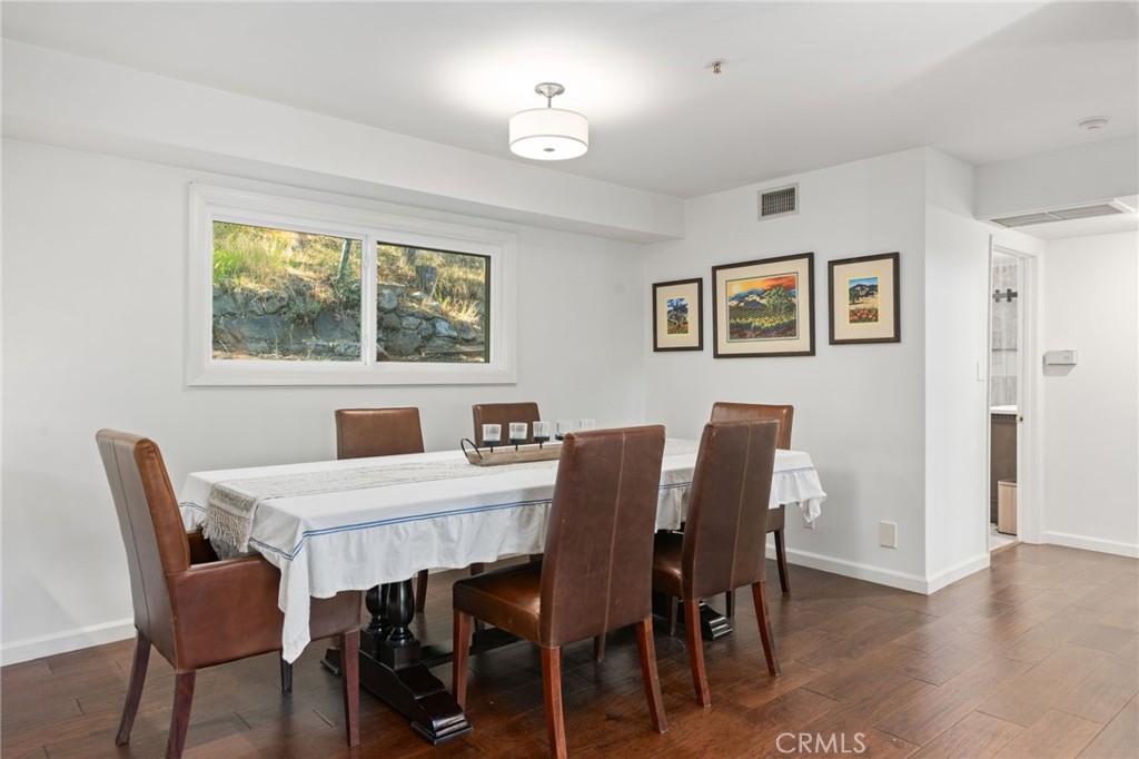 9729 Marcus Lane Tujunga, CA 91042 - Photo 13 of 55 a view of a dining room with furniture window and wooden floor