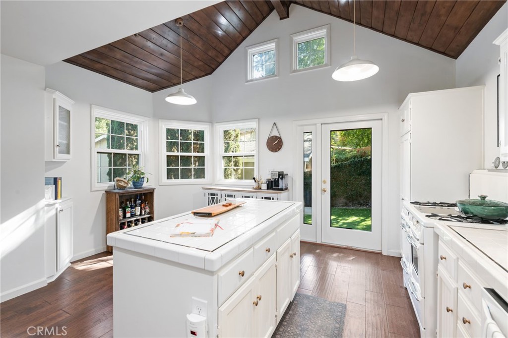 9729 Marcus Lane Tujunga, CA 91042 - Photo 20 of 55 a kitchen that has a sink a stove and a wooden floor