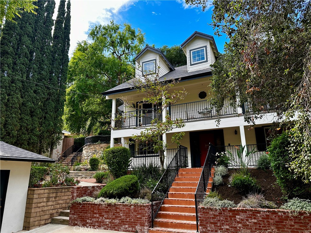 9729 Marcus Lane Tujunga, CA 91042 - Photo 2 of 55 a front view of a house with a yard
