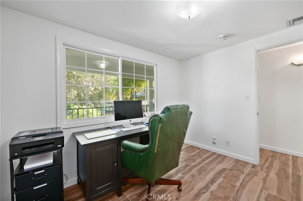 9729 Marcus Lane Tujunga, CA 91042 - Photo 24 of 55 a view of a workspace with furniture and a window