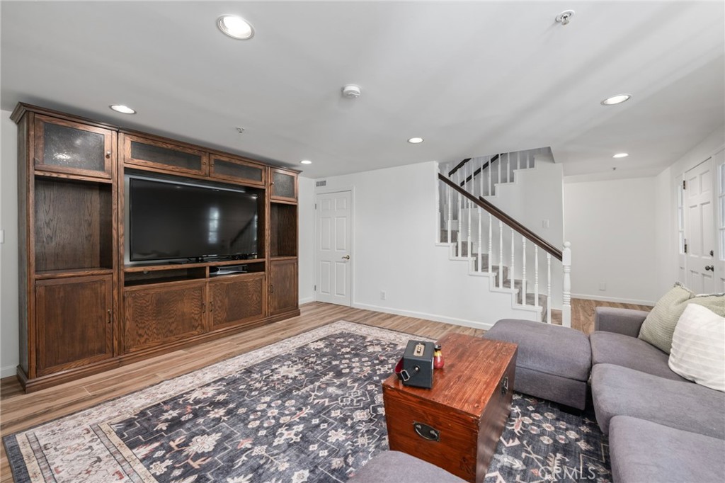 9729 Marcus Lane Tujunga, CA 91042 - Photo 28 of 55 a living room with furniture and a flat screen tv