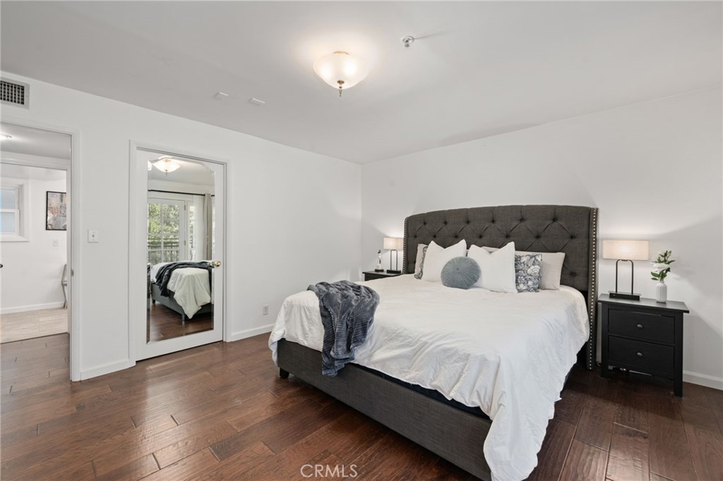 9729 Marcus Lane Tujunga, CA 91042 - Photo 32 of 55 a bedroom with a bed and a chair