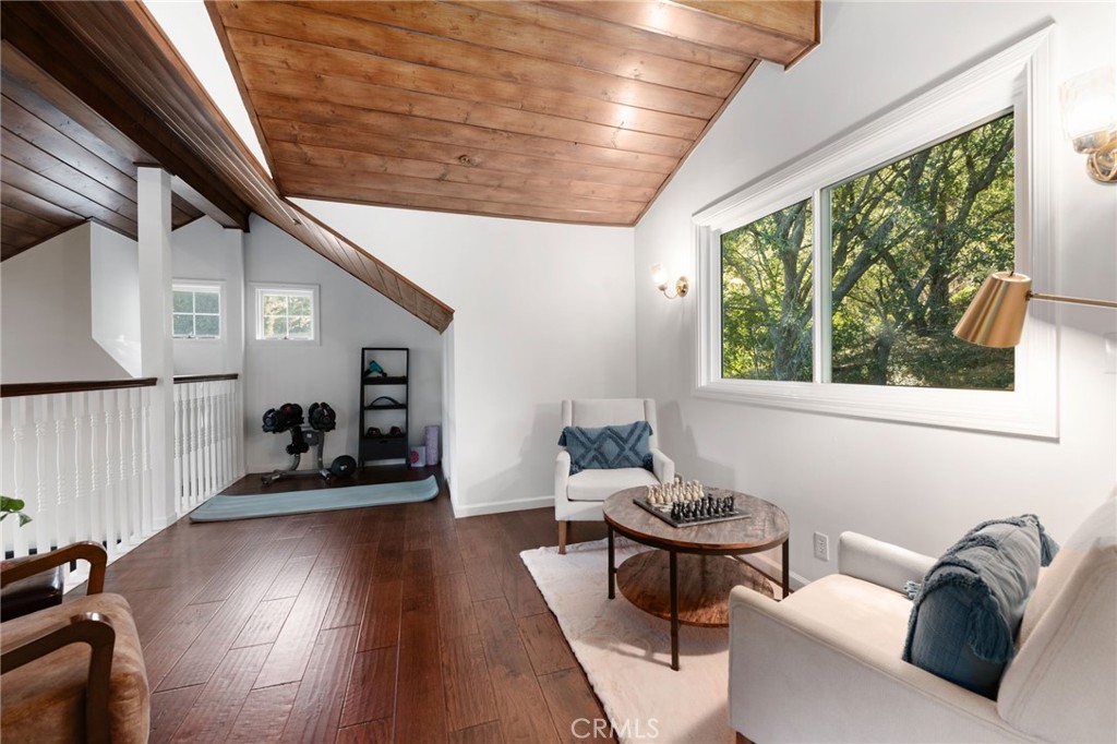 9729 Marcus Lane Tujunga, CA 91042 - Photo 36 of 55 a living room with furniture and a wooden floor