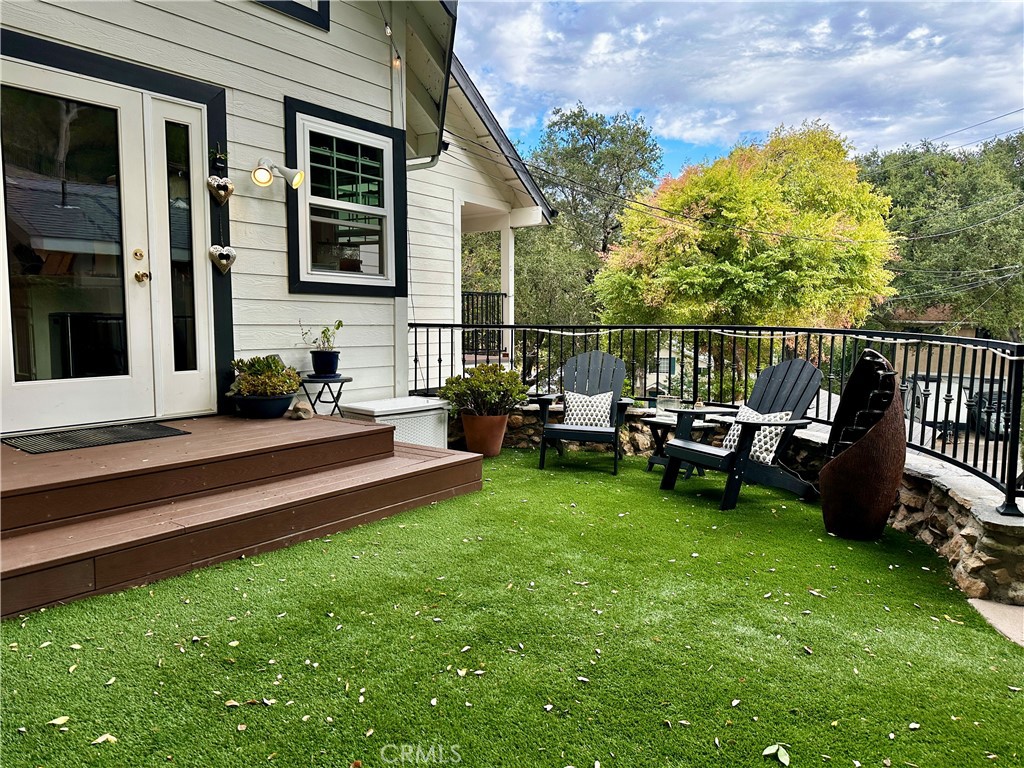 9729 Marcus Lane Tujunga, CA 91042 - Photo 48 of 55 a view of a house with backyard sitting area and garden
