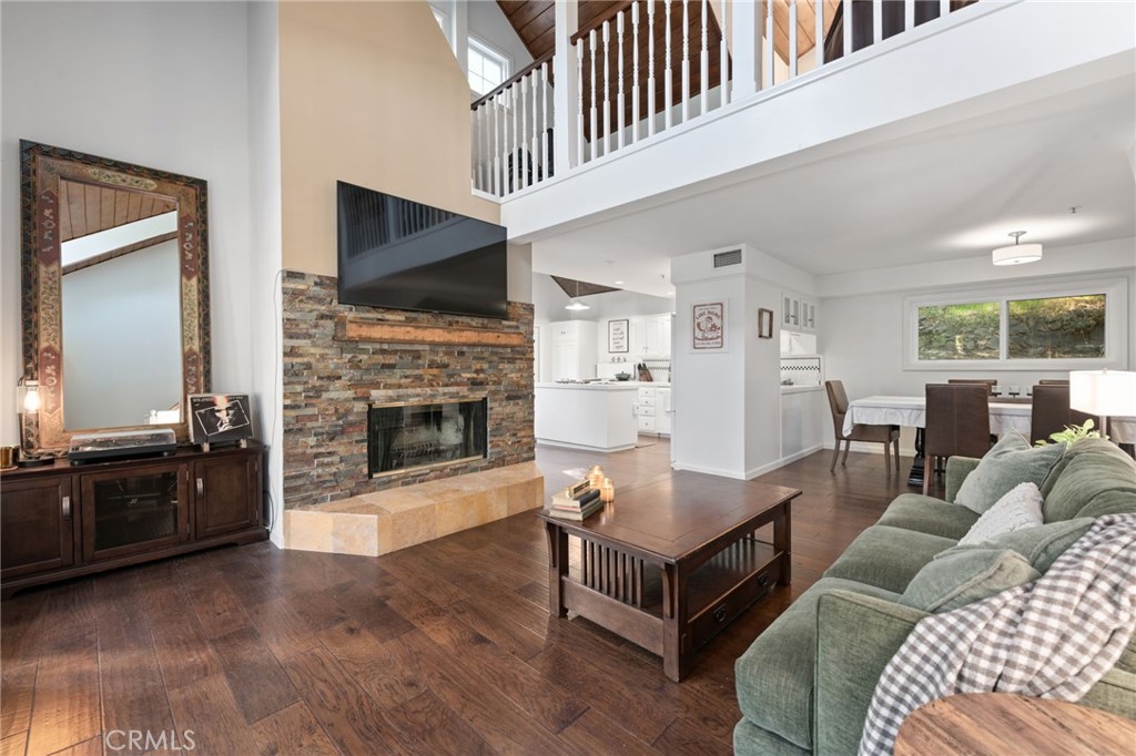 9729 Marcus Lane Tujunga, CA 91042 - Photo 7 of 55 a living room with furniture a flat screen tv and a fireplace