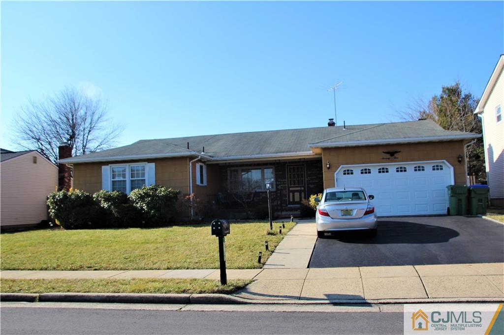 75 Rodak Circle Edison, NJ 08817 - Photo 2 of 32 a front view of a house with garden
