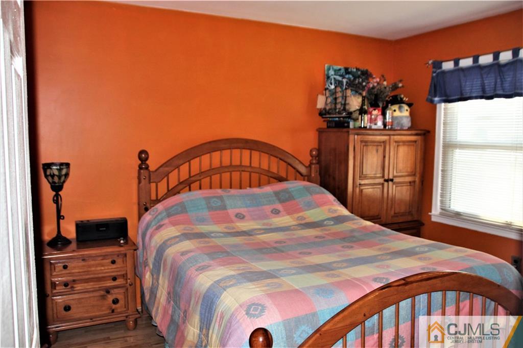 75 Rodak Circle Edison, NJ 08817 - Photo 12 of 32 a bed sitting in a bedroom next to a window