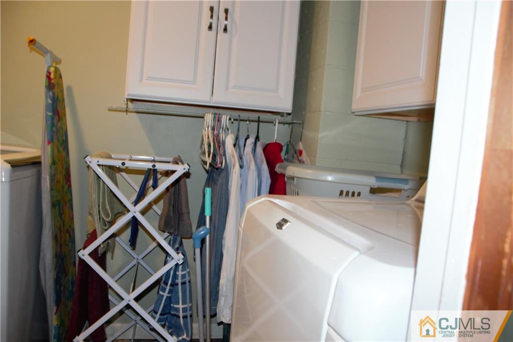 75 Rodak Circle Edison, NJ 08817 - Photo 23 of 32 a utility room with dryer and washer