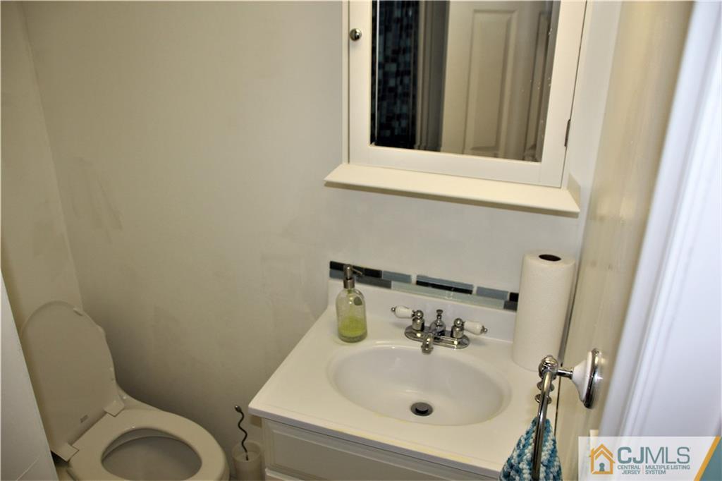 75 Rodak Circle Edison, NJ 08817 - Photo 26 of 32 a bathroom with a toilet and sink