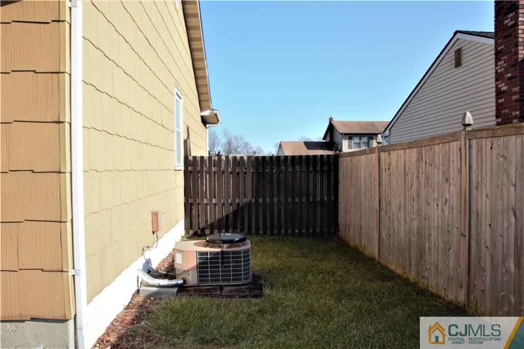 75 Rodak Circle Edison, NJ 08817 - Photo 29 of 32 a backyard of a house with wooden fence