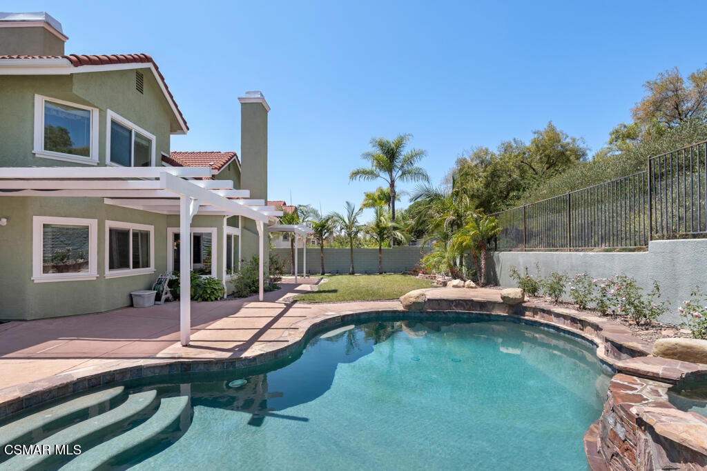 5339 Seneca Place Simi Valley, CA 93063 - Photo 60 of 76 a view of pool with lawn chairs and wooden fence