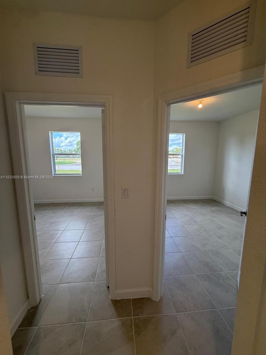 2942 Southeast 23rd Avenue Homestead, FL 33035 - Photo 16 of 20 a view of an empty room and window