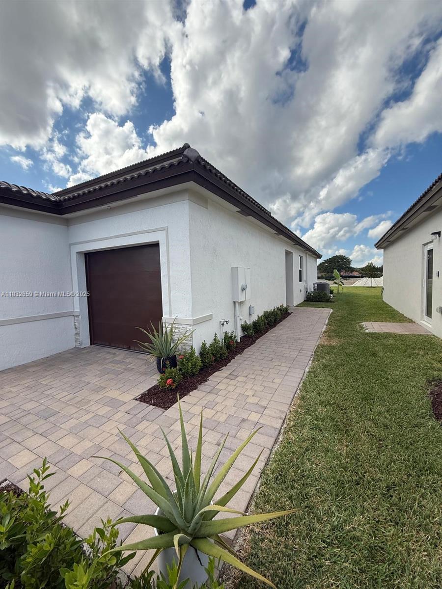 2942 Southeast 23rd Avenue Homestead, FL 33035 - Photo 2 of 20 a house with yard and a garden