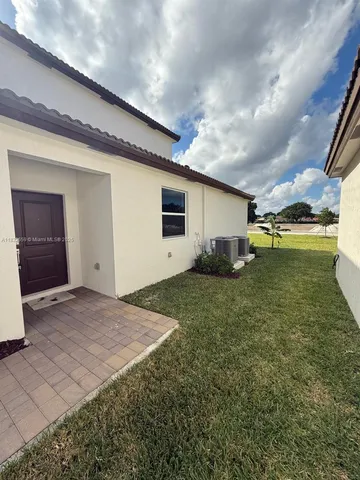 a house view with a backyard space