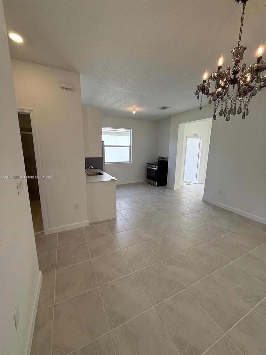 2942 Southeast 23rd Avenue Homestead, FL 33035 - Photo 9 of 20 a view of a kitchen with a sink and a window