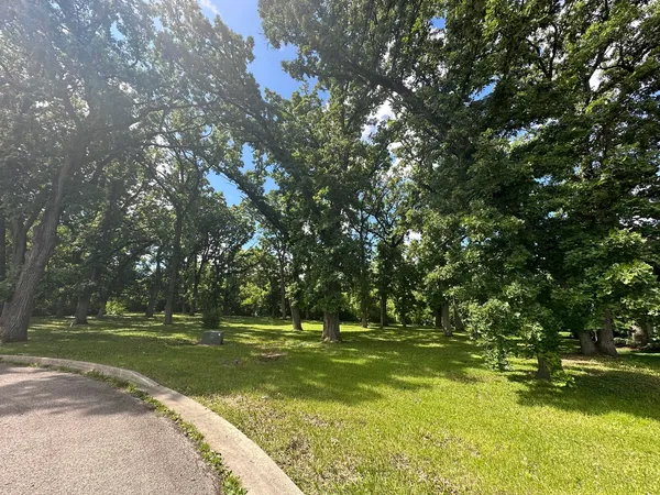 a view of a golf course with a lake